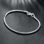Ženska narukvica od srebra, zmijski vez sa standardnom kopčom